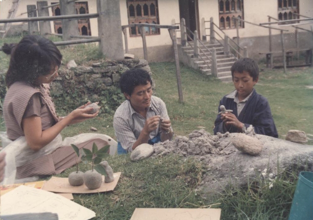 photo: Students making models out of clay.